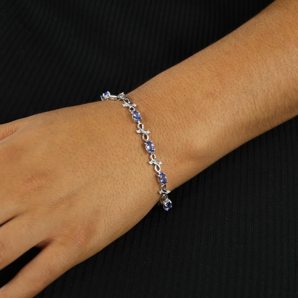 Parure avec Bague, Collier et Pendentif, Boucles d'oreilles et Bracelet en Or blanc 14k et 18k avec Tanzanites
