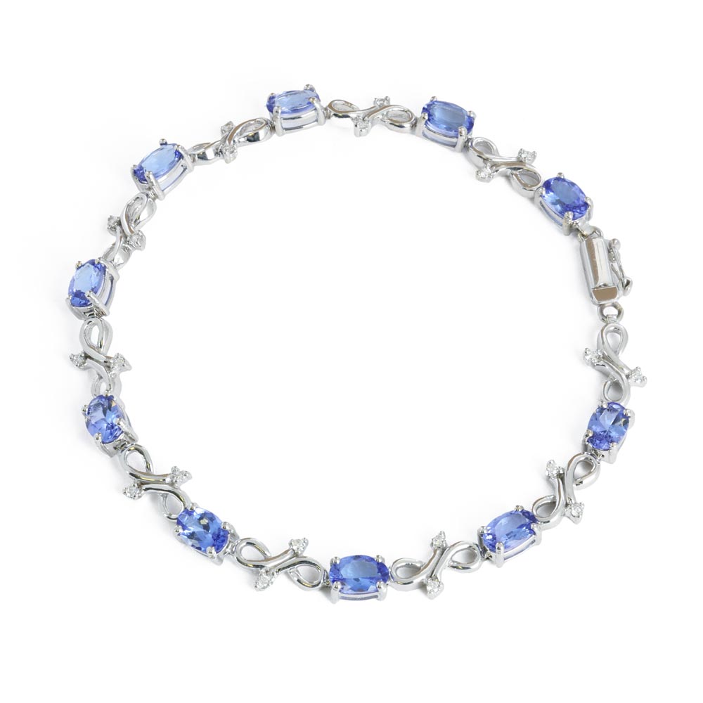Parure avec Bague, Collier et Pendentif, Boucles d'oreilles et Bracelet en Or blanc 14k et 18k avec Tanzanites
